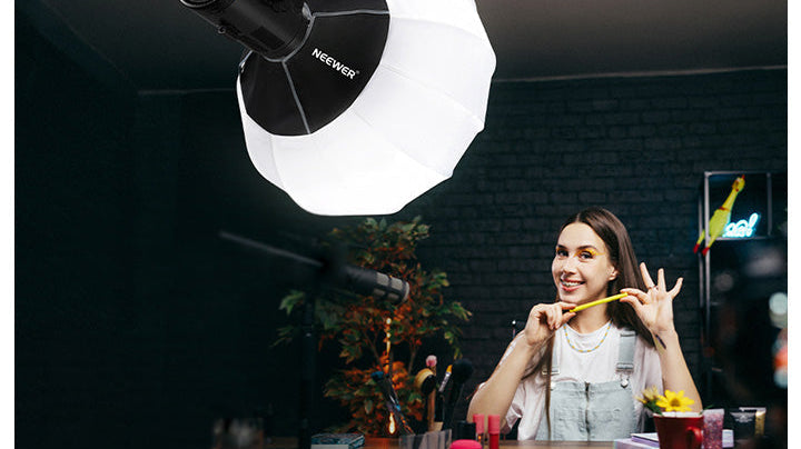 A content creator is using a softbox for product photography.