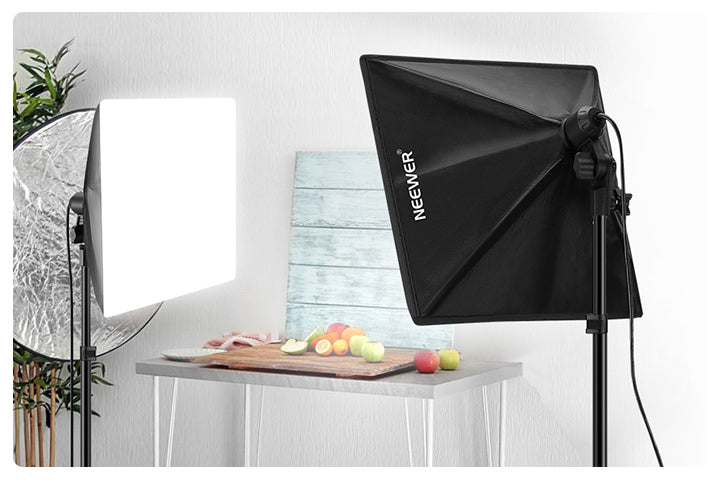 Two softboxes positioned on either side of a product subject, illustrating how directional softbox placement controls spill and shapes light compared to a single bare or umbrella key