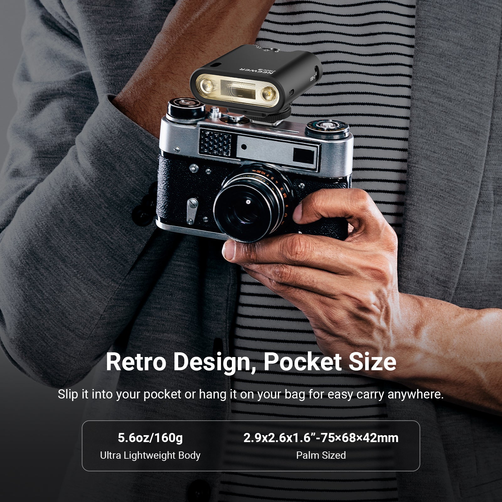 The NEEWER Z160U Stylish Mini On-Camera Flash is held in one hand at chest level